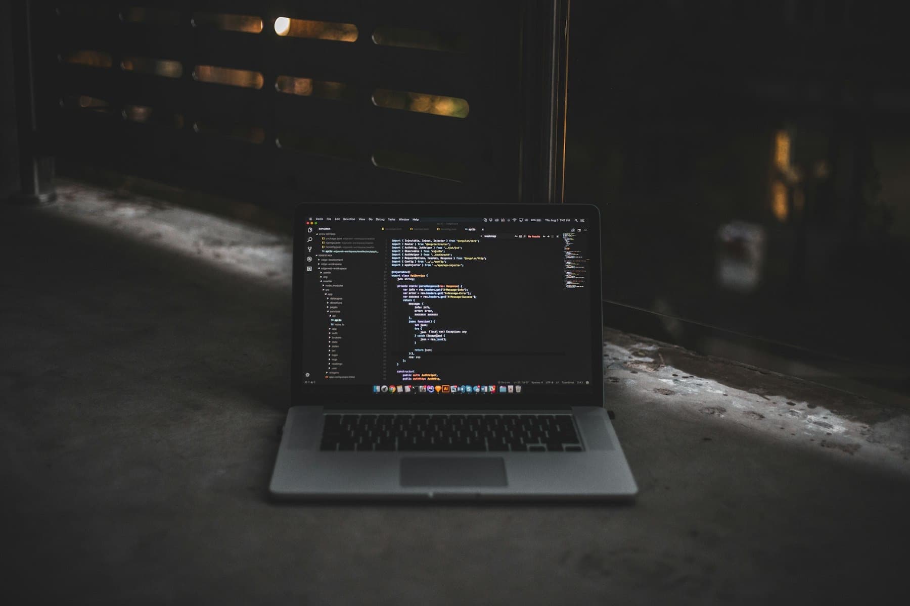 Code on a screen in a dark room