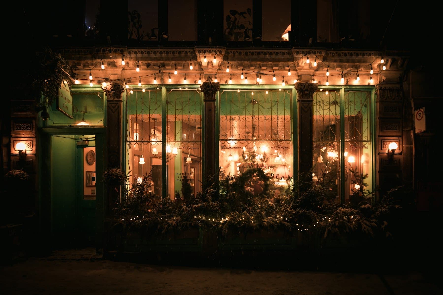 A small shopfront lit at night